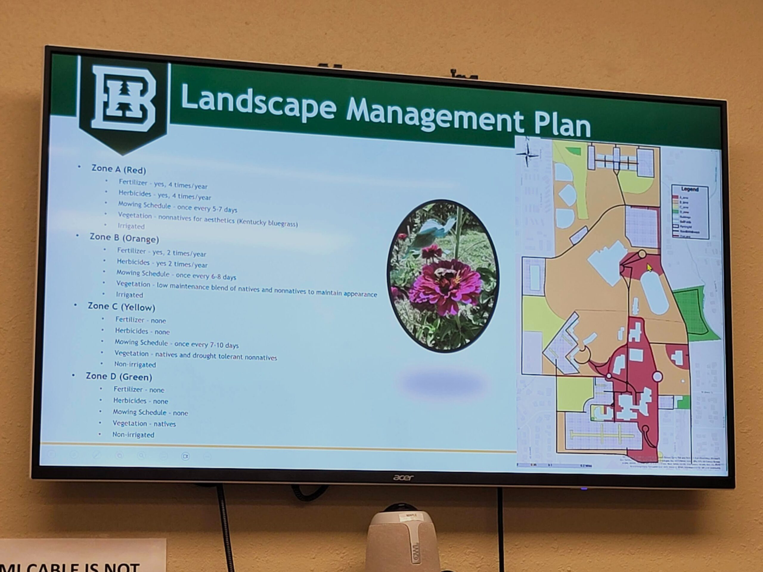 A photo of a presentation slide showing a colorful map of a campus.